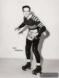 Black-and-white studio portrait of roller skater Gus Gabrovic posing in uniform and quad skates.