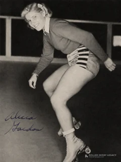 Alicia Gaidas crouches on quad roller skates in a black-and-white rink portrait signed at lower left.